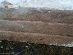 And it has three evenly cut lines in a side of a stone, each 7 cm apart, making it 21 cm in hight at a side point of a ledge.